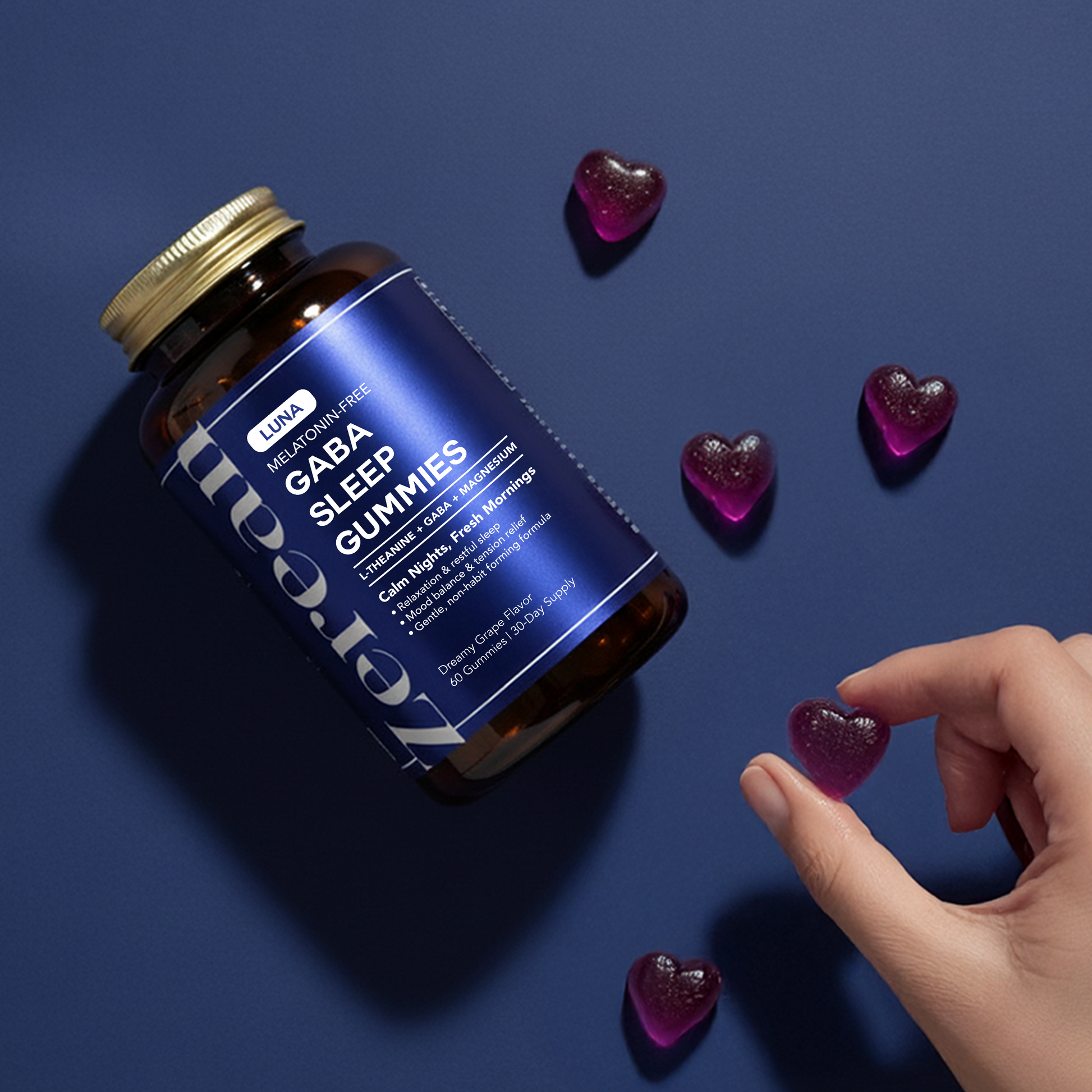 Hand reaching for heart-shaped Zerean Luna gummy beside bottle — melatonin-free sleep gummies with GABA and L-theanine for relaxation.