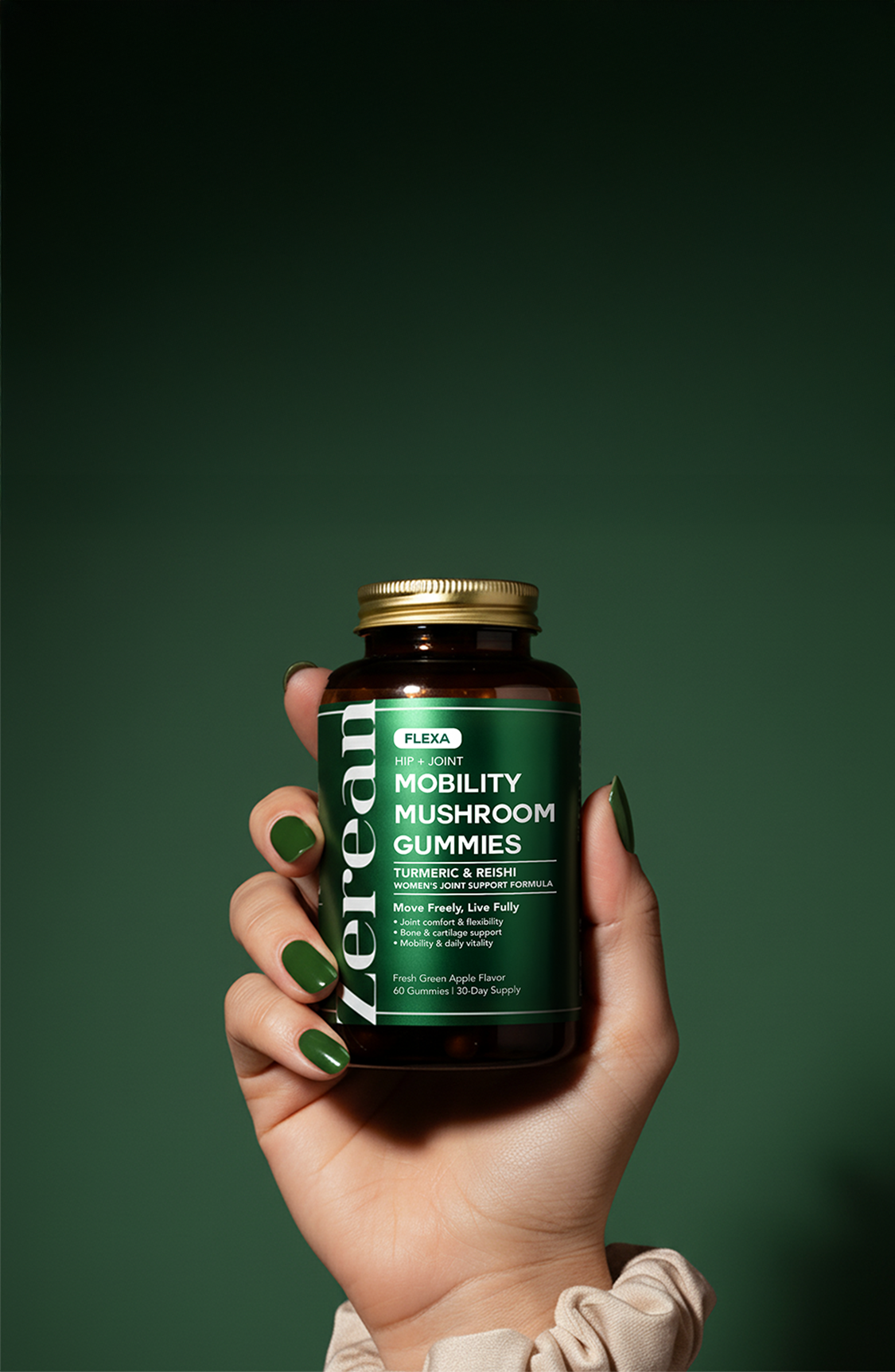 Hand holding Zerean Flexa Mobility Mushroom Gummies bottle — clinically proven joint and bone support with turmeric and reishi for flexibility.